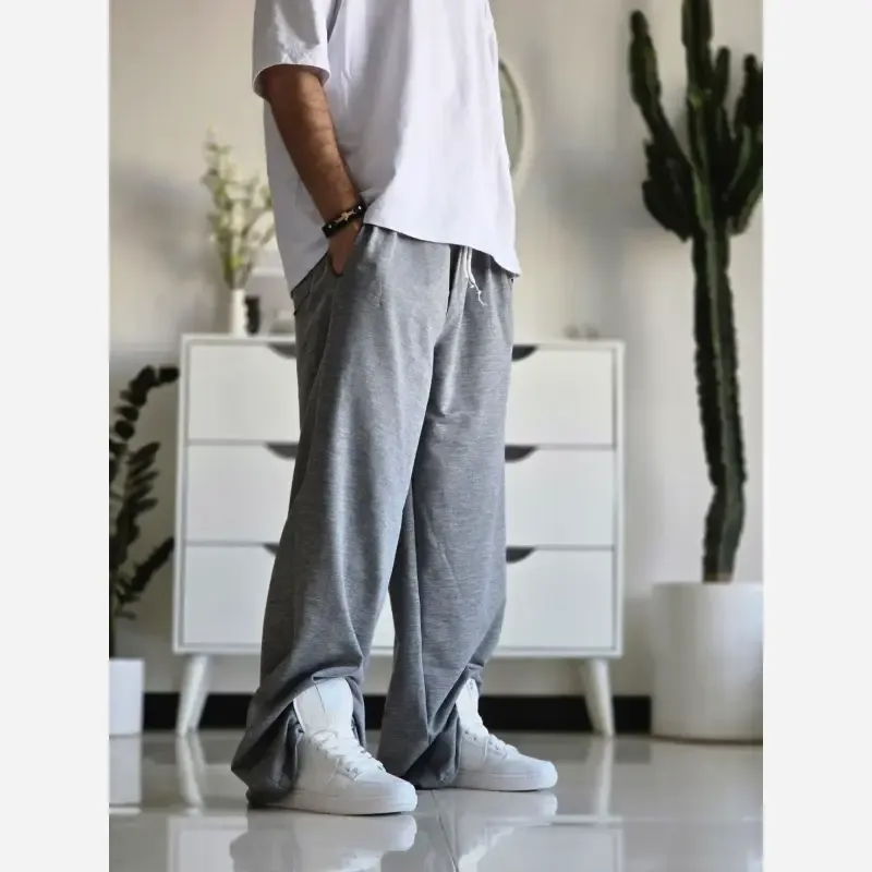 شلوار اسلش فول بگ پارچه ملانژ رنگ مشکی طوسی برفی سایز XXL و XXXL مناسب آقایان و خانم ها قد 115