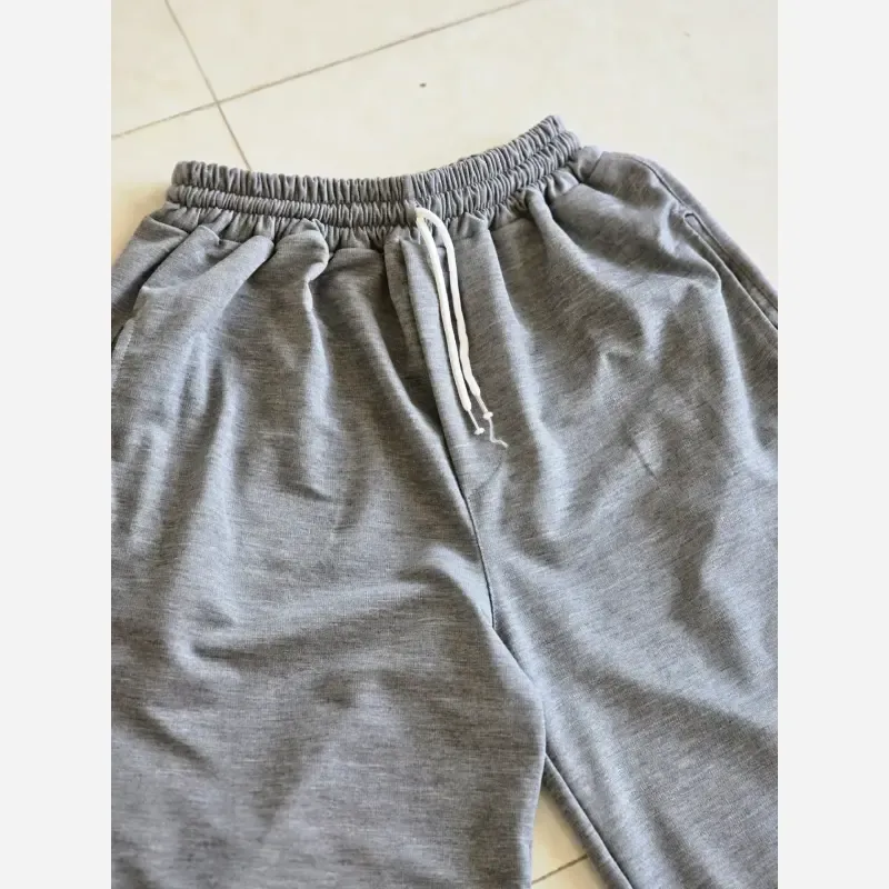 شلوار اسلش فول بگ پارچه ملانژ رنگ مشکی طوسی برفی سایز XXL و XXXL مناسب آقایان و خانم ها قد 115